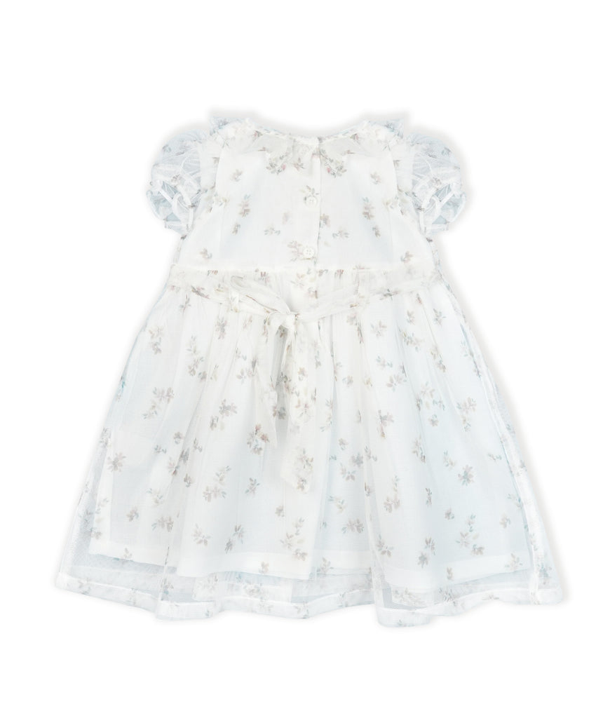 White dress with floral pattern on a white background