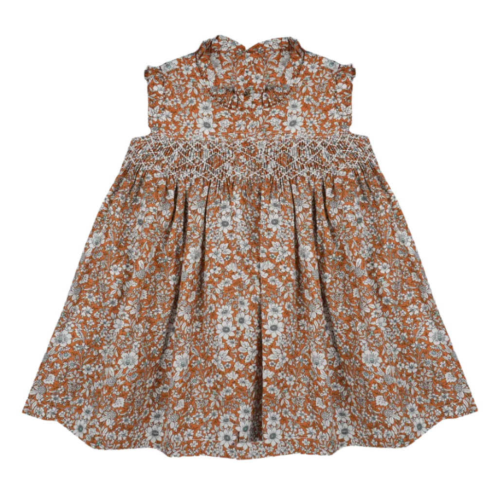 Floral dress with brown and white pattern on a light gray background